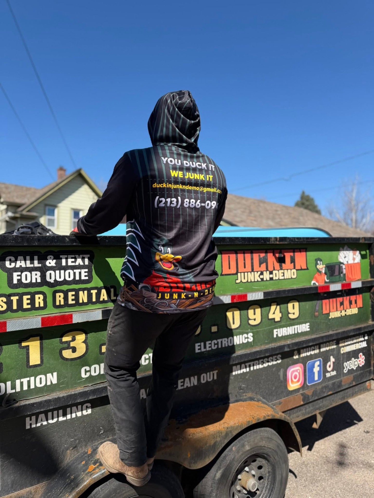 Duckin Junk-N-Demo crew loading a junk trailer
